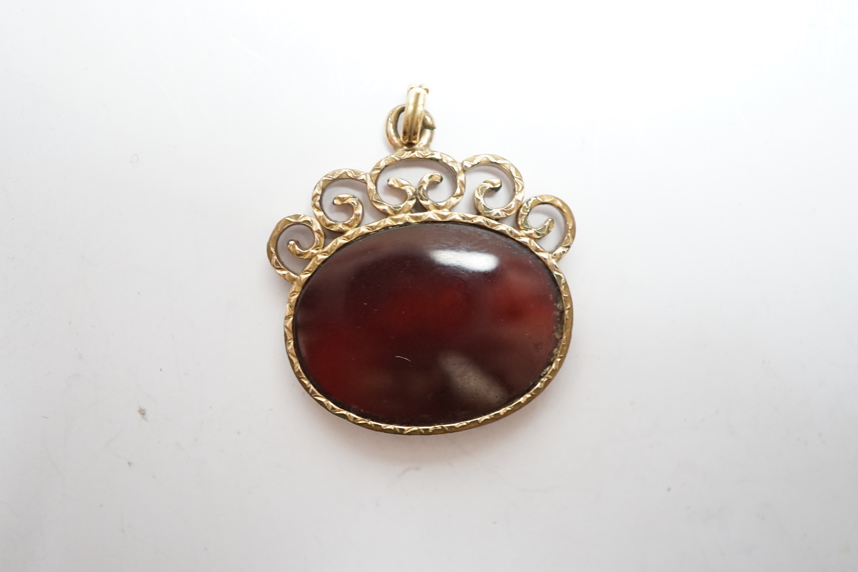 A yellow metal mounted oval intaglio agate? pendant, carved with the bust of a lady to dexter, width 26mm.